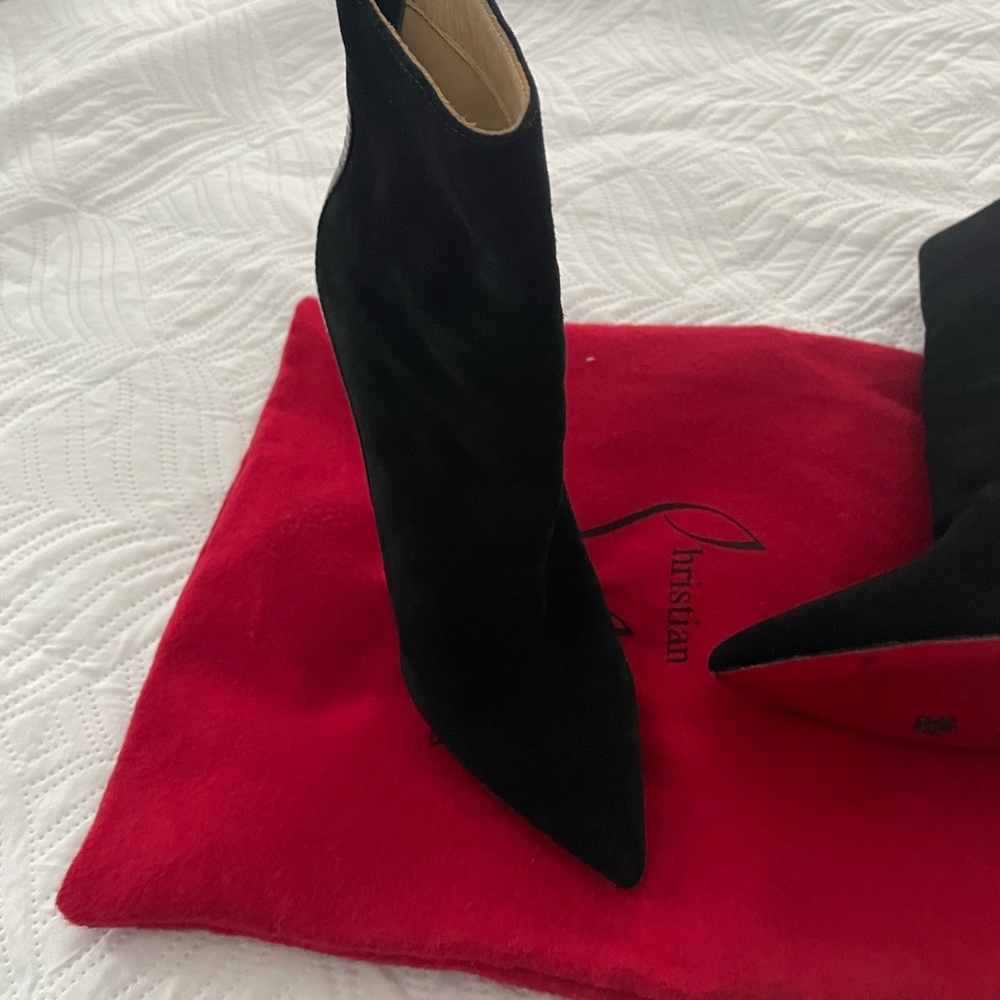 Christian Louboutin Red Bottom Boots.